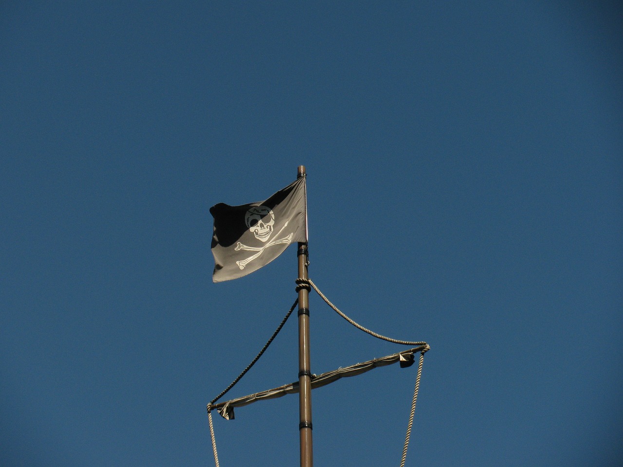 A pirate flag at the top of the mast
