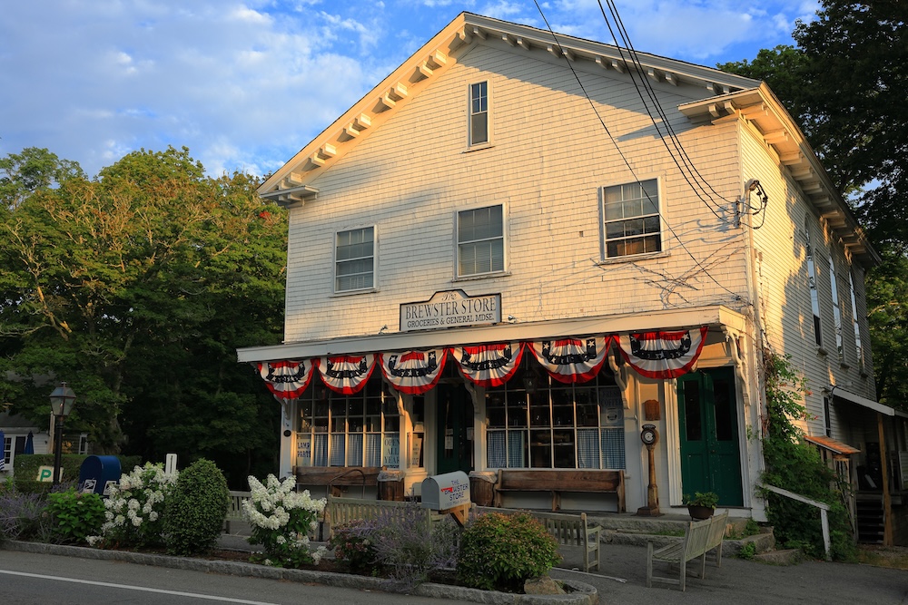 Store front of the iconic Brewster General Store at first light in the summertime on Cape Cod
