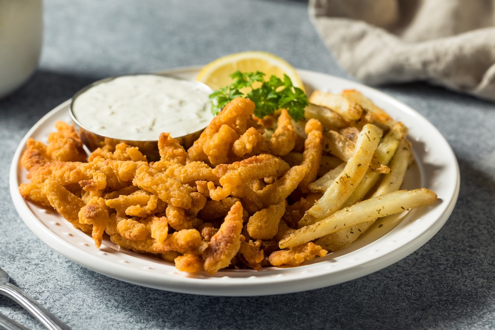 Homemade Fried Clam Strips with Fries and Tartar Sauce.